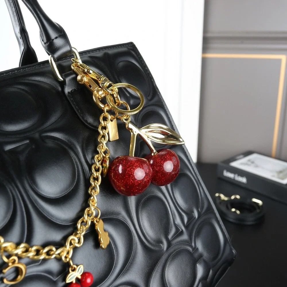 COACH Maggie Quilted Tote Bag with Decorative Cherry Charm - Picture 9 of 9